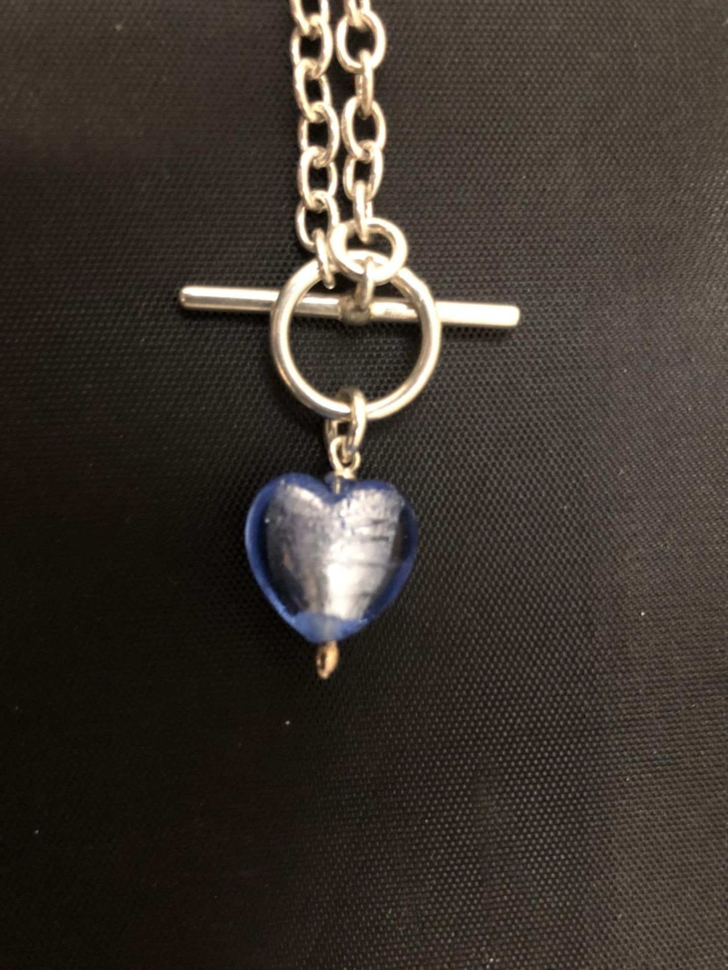 A SILVER T-BAR NECKLACE WITH A BLUE STONE - Image 2 of 2