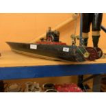 A MAMOD STEAM ENGINE MOUNTED ON A VINTAGE WOODEN MODEL BOAT