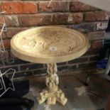 A CARVED ORIENTAL PEDESTAL/TABLE IN RESIN