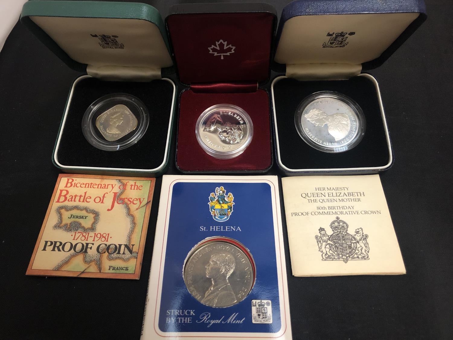 FOUR COMMEMORATIVE COINS IN PRESENTATION WALLETS AND BOXES