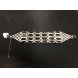 THREE SILVER SIX BAR GATE BRACELETS