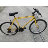 A 15 GEAR SHIMANO YELLOW MENS MOUNTAIN BIKE