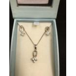 A BOXED SILVER NECKLACE SET WITH A SOLITAIRE PAVE STONE
