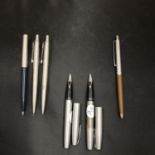 TWO SHEAFFER FOUNTAIN PENS, THREE PARKER BALLPOINT PENS AND A PAPER MATE BALLPOINT PEN