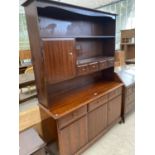 A STAG MINSTREL MAHOGANY DRESSER WITH THREE DOORS, THREE DRAWERS, FOUR UPPER DRAWERS AND ONE DOOR