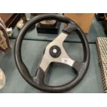 A SPORTS CAR STEERING WHEEL