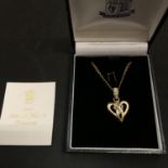 A ROYAL MINT ETERNAL HEART PENDANT SET IN A 9CT GOLD MOUNT AND NECKLACE GRAMS 4.4 GRAMS