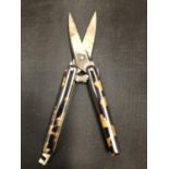 A PAIR OF TORTOISE SHELL FOLDING SCISSORS