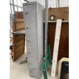 A TALL METAL SIX DOOR LOCKER