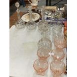 AN ASSORTMENT OF GLASSWARE TO INCLUDE CUT GLASS DECANTERS AND ROSE PINK ICE CREAM BOWLS