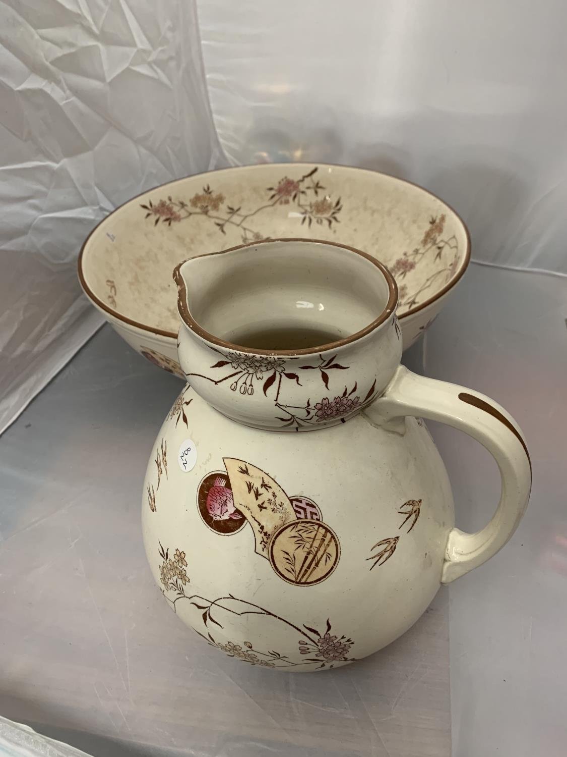 A ROYAL DOULTON JUG AND BOWL