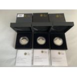 THREE SILVER PROOF £5 COINS IN PRESENTATION BOXES WITH CERTIFICATES