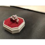 A WHITE METAL TIGER RING