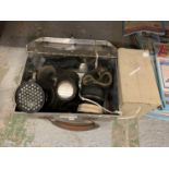 TWO WWII GAS MASKS AND A METAL CASE