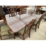 A GEORGIAN STYLE TWIN PEDESTAL DINING TABLE, 68x44" AND SIX CHIPPENDALE STYLE CHAIRS BY UNIVERSAL