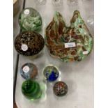 AN ASSORTMENT OF COLOURED GLASS PAPERWEIGHTS