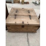 A MEXICAN PINE STORAGE BOX WITH DOUBLE SIDED LIFT-UP LIDS AND METAL STRAPS