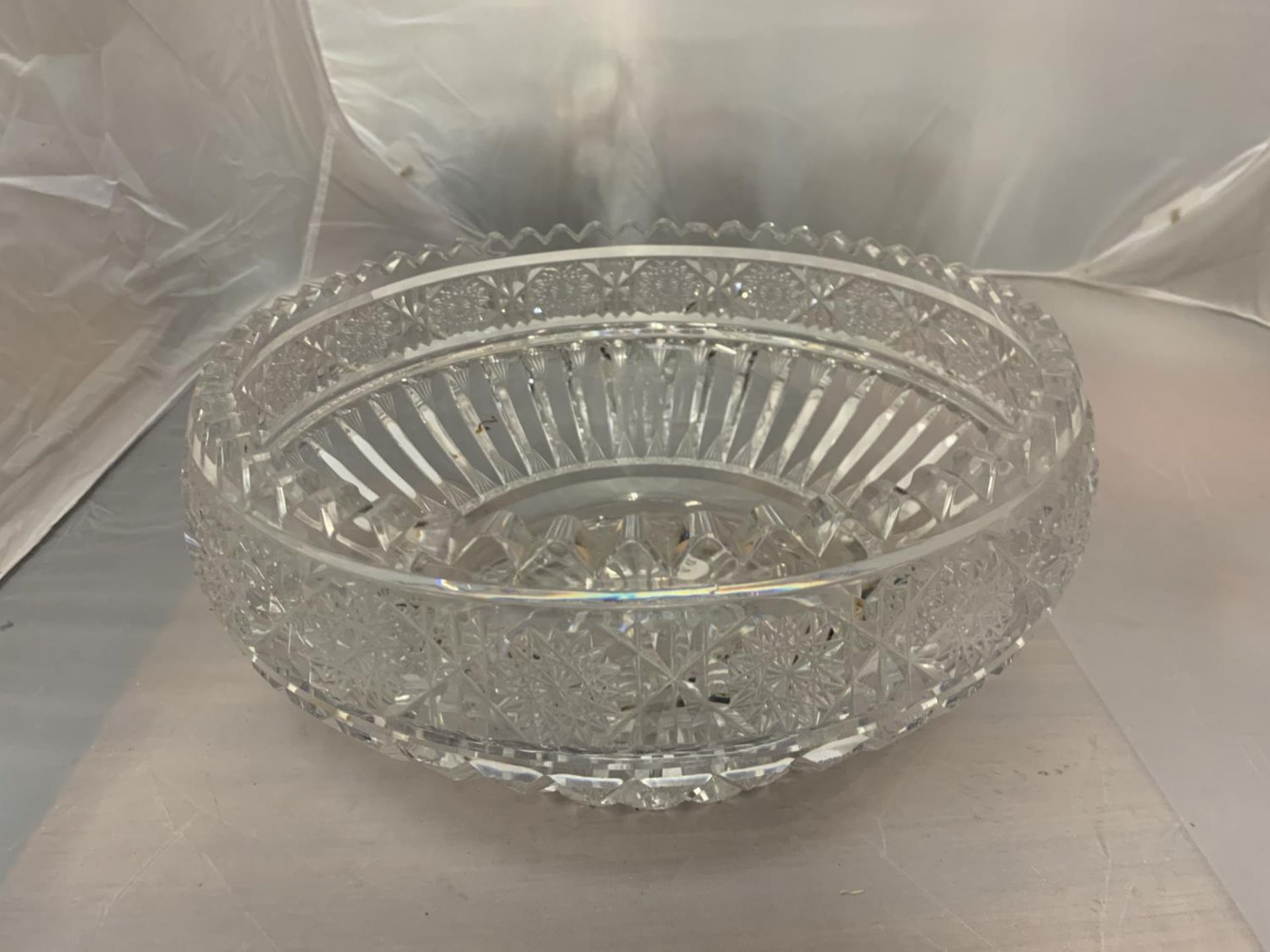 A LARGE CUT GLASS BOWL