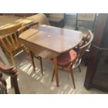 A PAIR OF ERCOL SPINDLE BACK KITCHEN CHAIRS AND DINETTE DROP LEAF TABLE