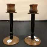 A PAIR OF TORTOISE SHELL CANDLE STICKS