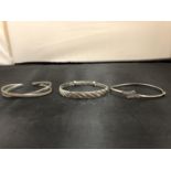 THREE SILVER BANGLES IN A BLACK BOX