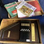 A BOXED AUTO HARP TO INCLUDE AN INSTRUCTION BOOK AND SHEET MUSIC