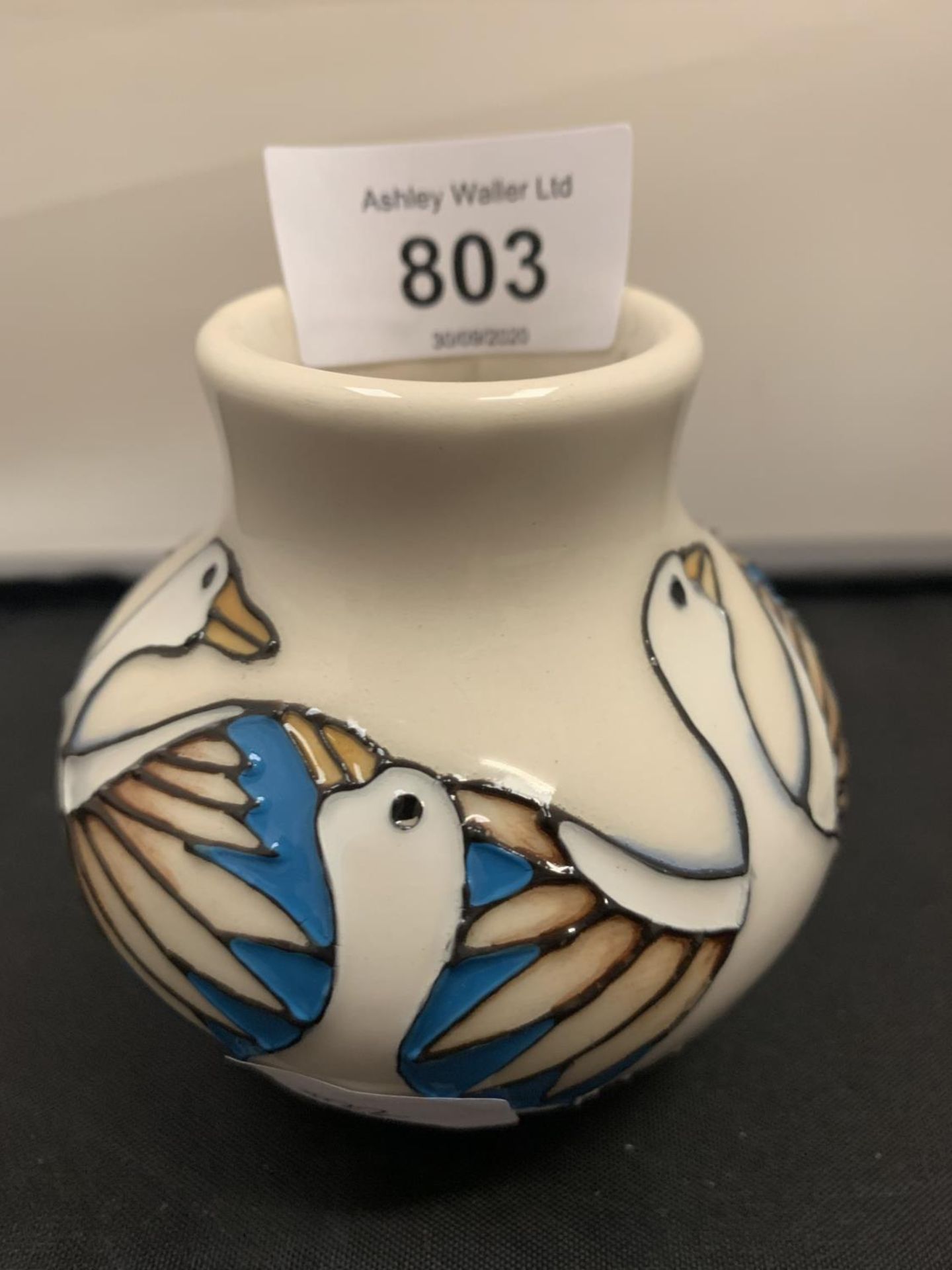 A MOORCROFT SIX GEESE LAYING 3 INCH VASE
