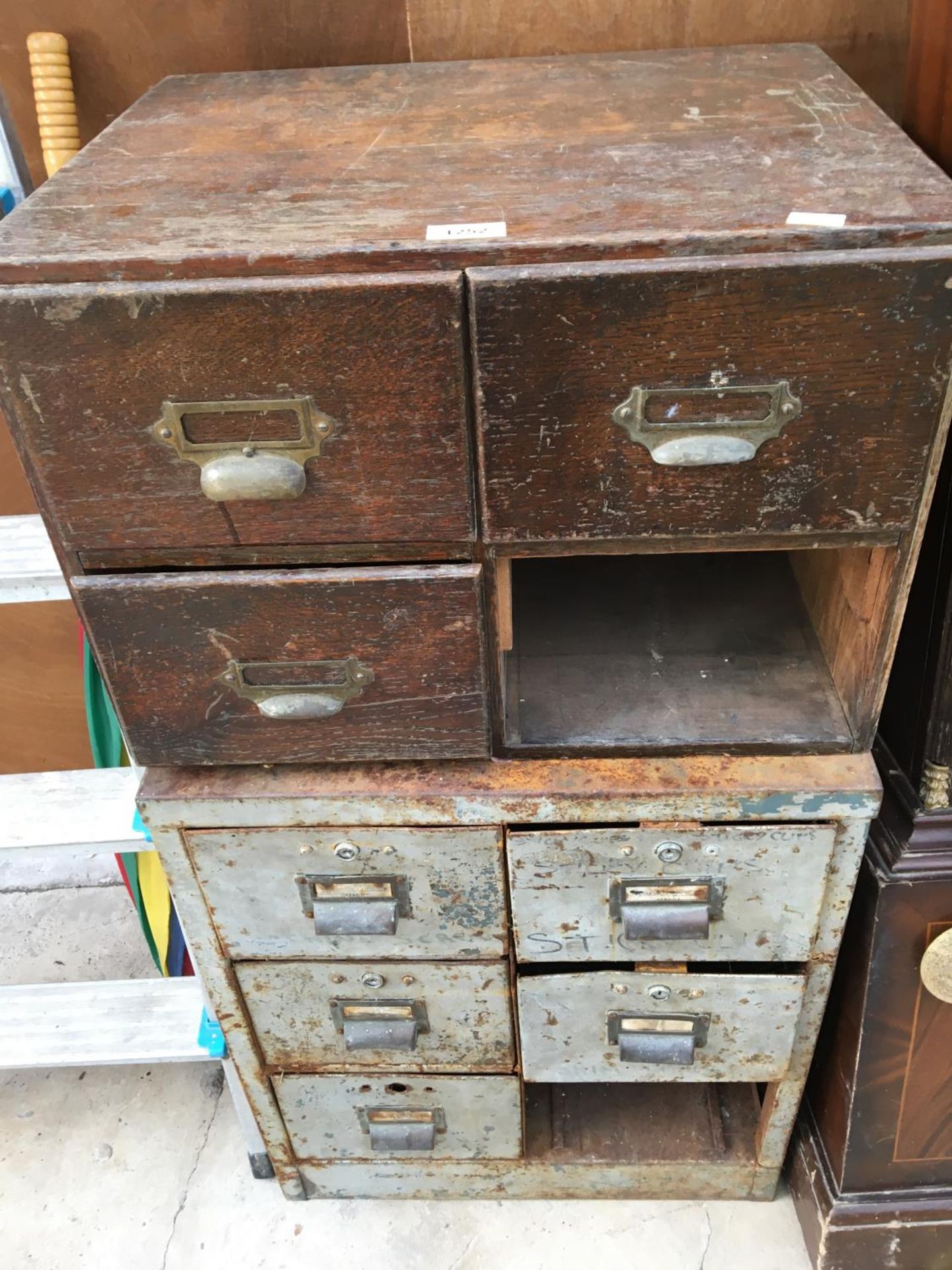 A WOODEN FOUR DRAWER (ONE MISSING) VINTAGE SET OF DRAWERS WITH BRASS HANDLES AND A FURTHER SET OF