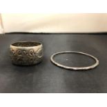 A SILVER NAPKIN RING AND BANGLE