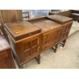 AN EARLY 20TH CENTURY OAK SIDEBOARD ON TURNED LEGS