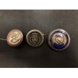 THREE VINTAGE STERLING SILVER AND ENAMEL BADGES