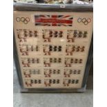 A LARGE FRAMED COLLECTION OF ROYAL MAIL FIRST DAY COVERS OF GOLD MEDAL WINNERS AT THE LONDON