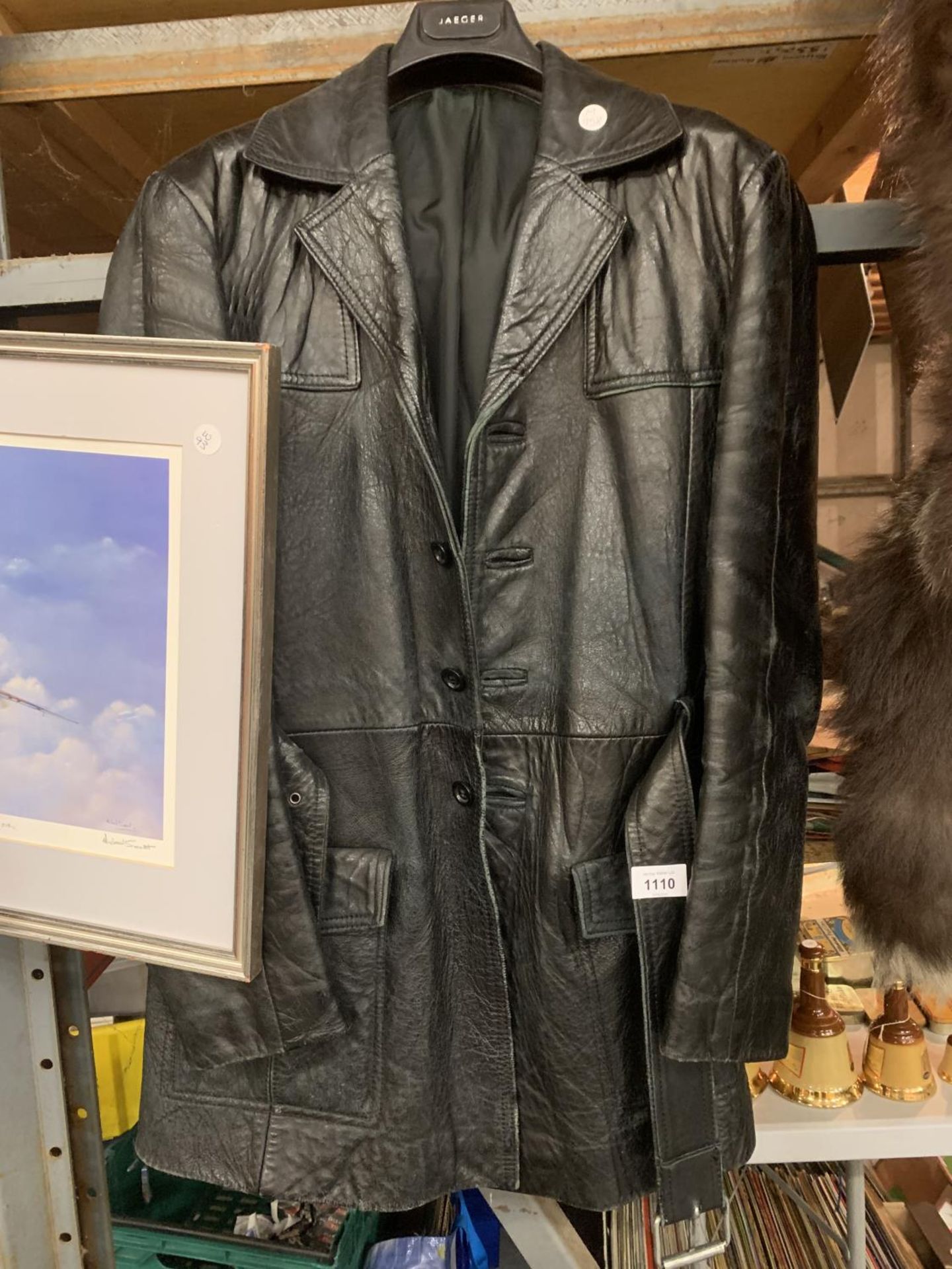 A LEATHER COAT WITH BELT