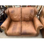 A MODERN LEATHER TWO SEATER SETTEE