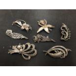 SEVEN SILVER BROOCHES