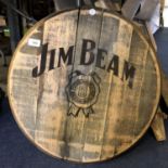 A ROUND WOODEN 'JIM BEAM' BARREL TOP