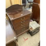 AN EDWARDIAN SIX DRAWER MUSIC CHEST ON CABRIOLE LEGS, TOGETHER WITH A QUANTITY OF MUSIC AND