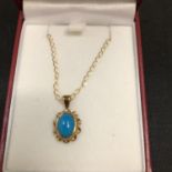 A TURQUOISE PENDANT ON A 9CT GOLD NECKLACE 2.1 GRAMS