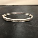 A BOXED SILVER BANGLE