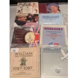 EIGHT GB AND GUERNSEY COMMEMORATIVE COINS IN PRESENTATION WALLETS
