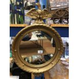 A ROUND GILT EAGLE MIRROR