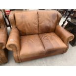 A MODERN LEATHER TWO SEATER SETTEE