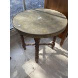 A CIRCULAR BRASS TOP FOLDING OCCASIONAL TABLE ON BARLEYTWIST BASE, 23" DIAMETER