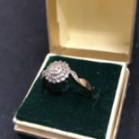 A 9CT GOLD RING WITH DIAMONDS