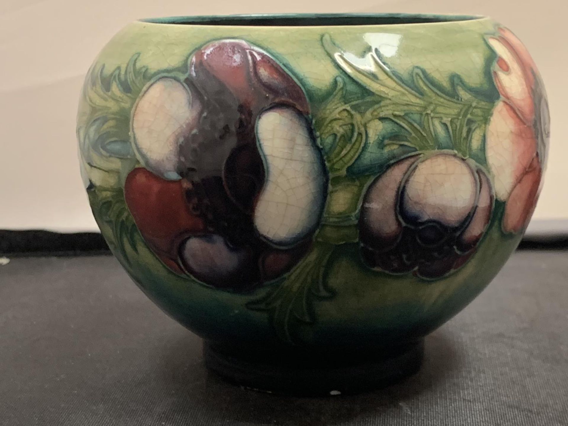 A MOORCROFT VASE ANEMONE DESIGN - SMALL CHIP TO BASE