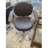 A MODERN SWIVEL OFFICE CHAIR ON FIVE PRONG BASE WITH OPEN ARMS