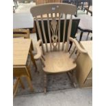 A VICTORIAN STYLE FARMHOUSE ROCKING CHAIR