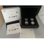 A SET OF FOUR SILVER PROOF £5 COINS - PORTRAIT PF BRITAIN WITH PRESENTATION BOX AND CERTIFICATES