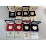 EIGHT VARIOUS SILVER PROOF CROWNS IN PRESENTATION BOXES WITH CERTIFICATES