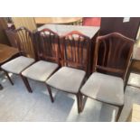 A SET OF FOUR MODERN DINING CHAIRS